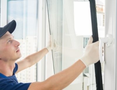 Man installing a window