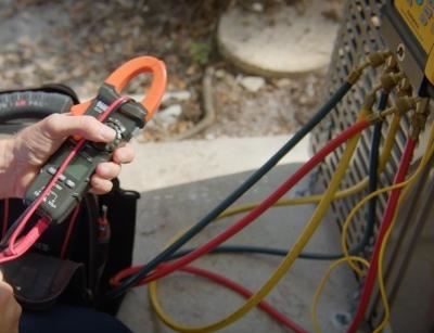 Person checking test AC unit