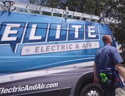 Technician in front of service van