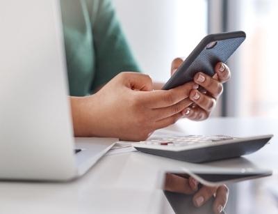 person using several calculators