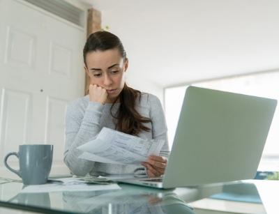 woman looking at her bills